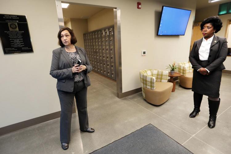 Napa County Chief Probation Officer Mary Butler, left, and Napa County Director of Department of Corrections, Dina Jose, right, prepare to lead a tour of the county's new jail reentry facility in south Napa. JL Sousa, Register