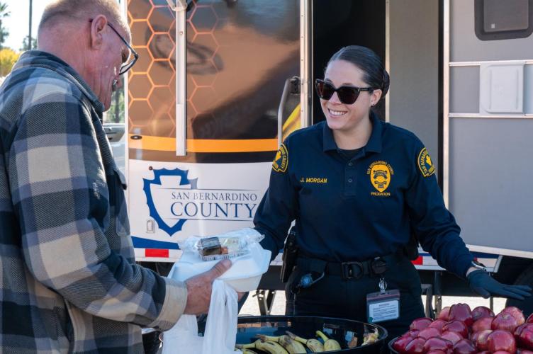 Probation's Homeless Outreach Unit serves meals and care packages to the homeless in their community.