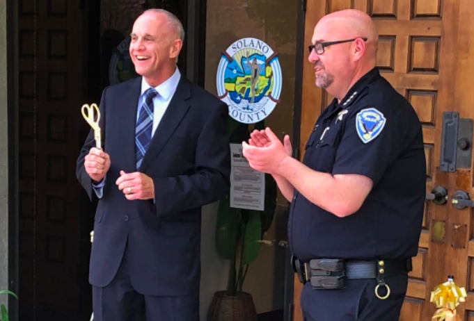 Moments after a ribbon-cutting, Solano County Chief Probation Officer Chris Hansen (left) and Fairfield Police Chief Dan Marshall on Thursday celebrate the official opening of the county Probation Department’s newly relocated Youth Services Center on Beck Avenue. (Reporter photo/ Richard Bammer)
