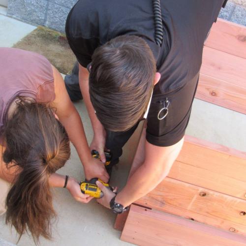 youth and staff working on garden box