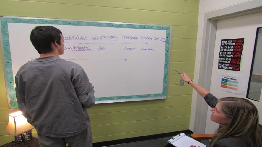 Youth at whiteboard in classroom